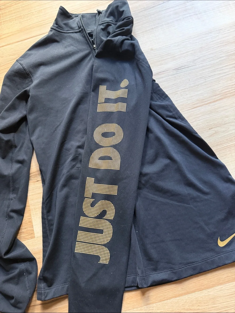 Nike Women’s Black Half-Zip Long-Sleeve Top with Gold Accents